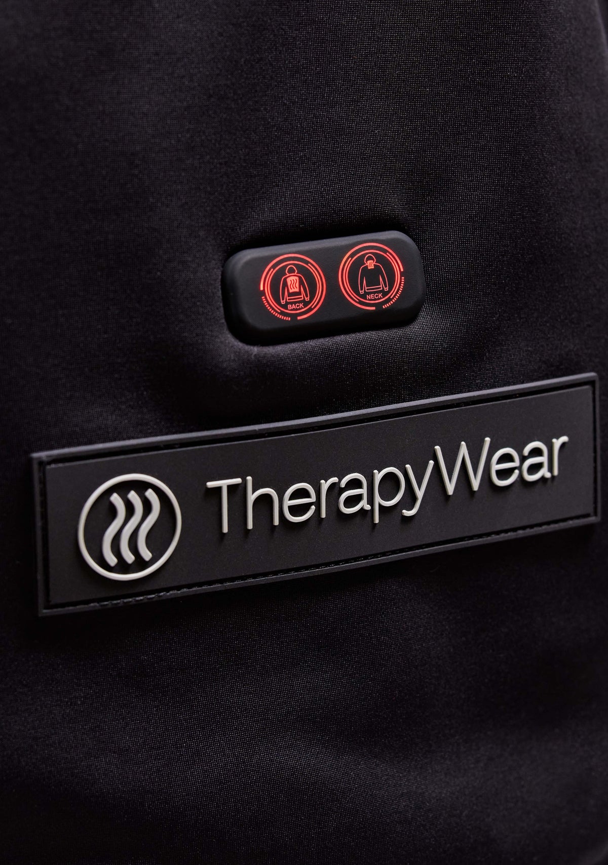 NECK and BACK heat buttons on the front pocket of the TherapyWear Relief Hoodie